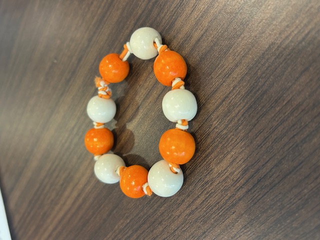 Orange and white beaded bracelet