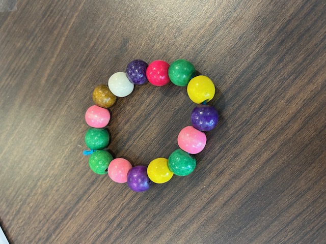 Green, pink, purple, and yellow beaded bracelet