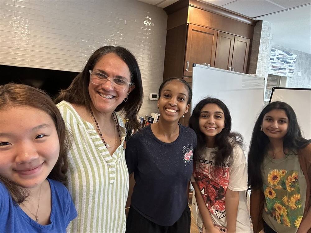 Club members smiling together during a visit
