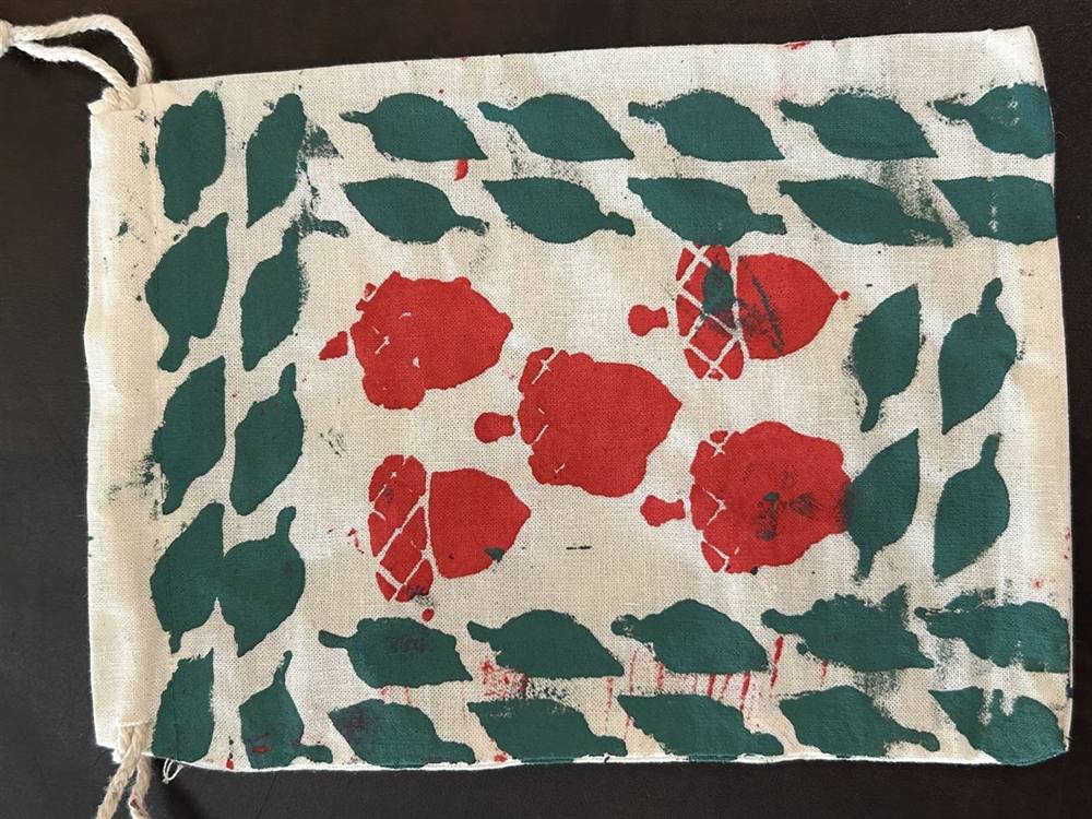 Hand-painted drawstring bag with roses and leaves